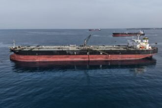 Oil falls as crude flows remain 'surprisingly strong'