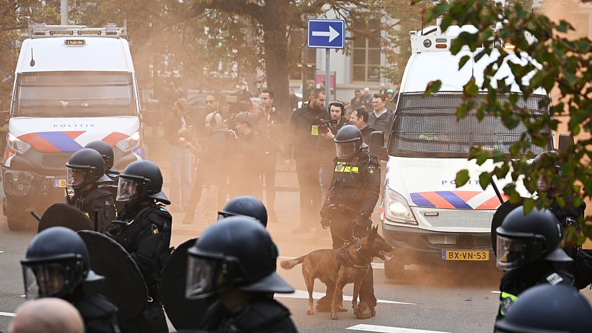 Police clash with far-right protesters at anti-immigration rally in The Hague