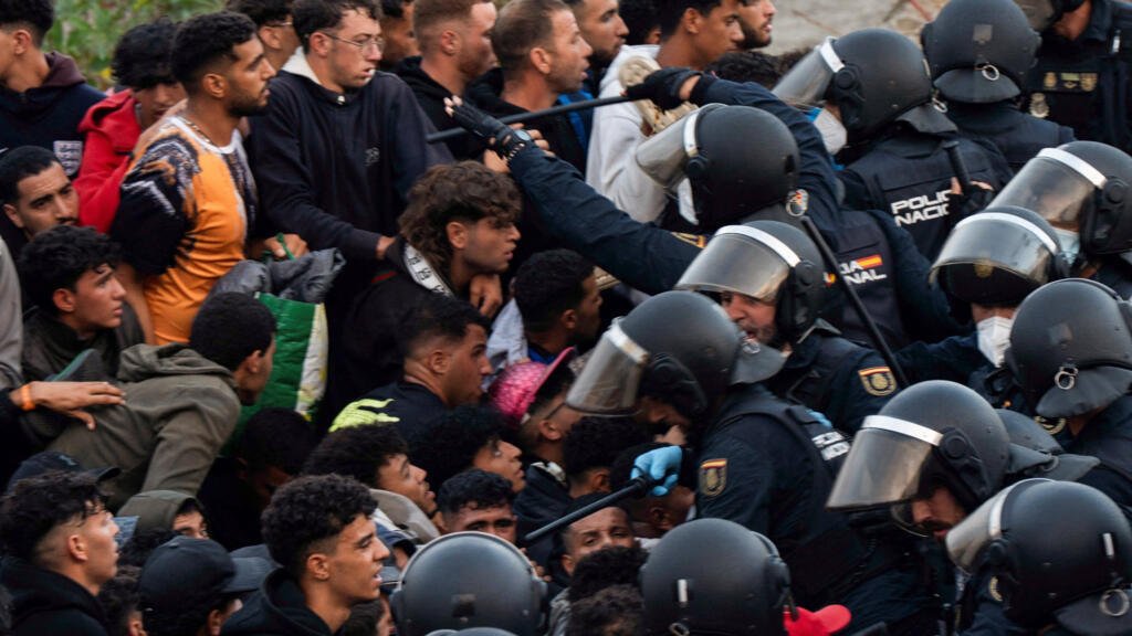 Spain's police launch operation to clear migrants off Ceuta beach