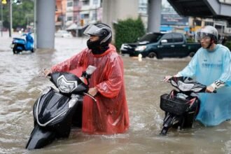 Bangkok roads submerged as flood disaster declared