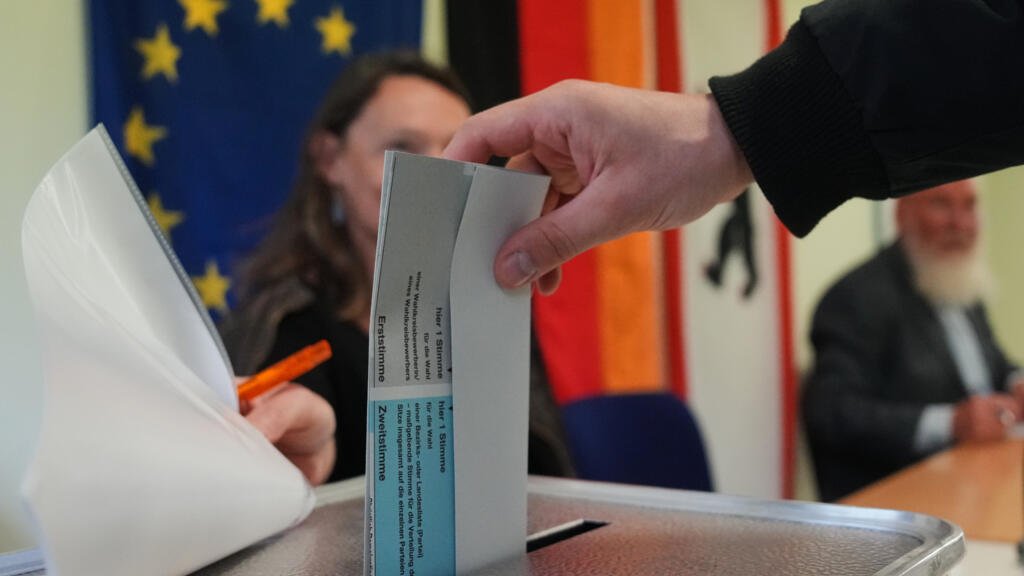 Voting begins in German elections threatening fresh defeat to Chancellor Merz
