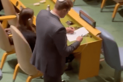 Israeli official takes notes after UN walkout against Netanyahu