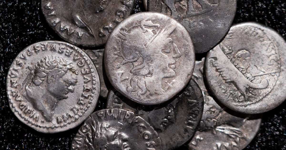 Metal detectorist finds record-breaking trove of ancient Roman coins
