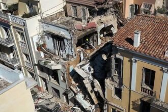 One dead and five missing after explosion destroys building close to Acropolis in Athens