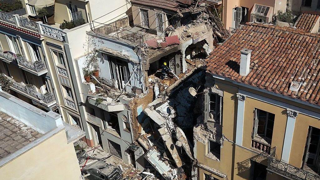 One dead and five missing after explosion destroys building close to Acropolis in Athens