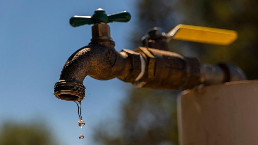 Homes without water and roads closed after burst pipe