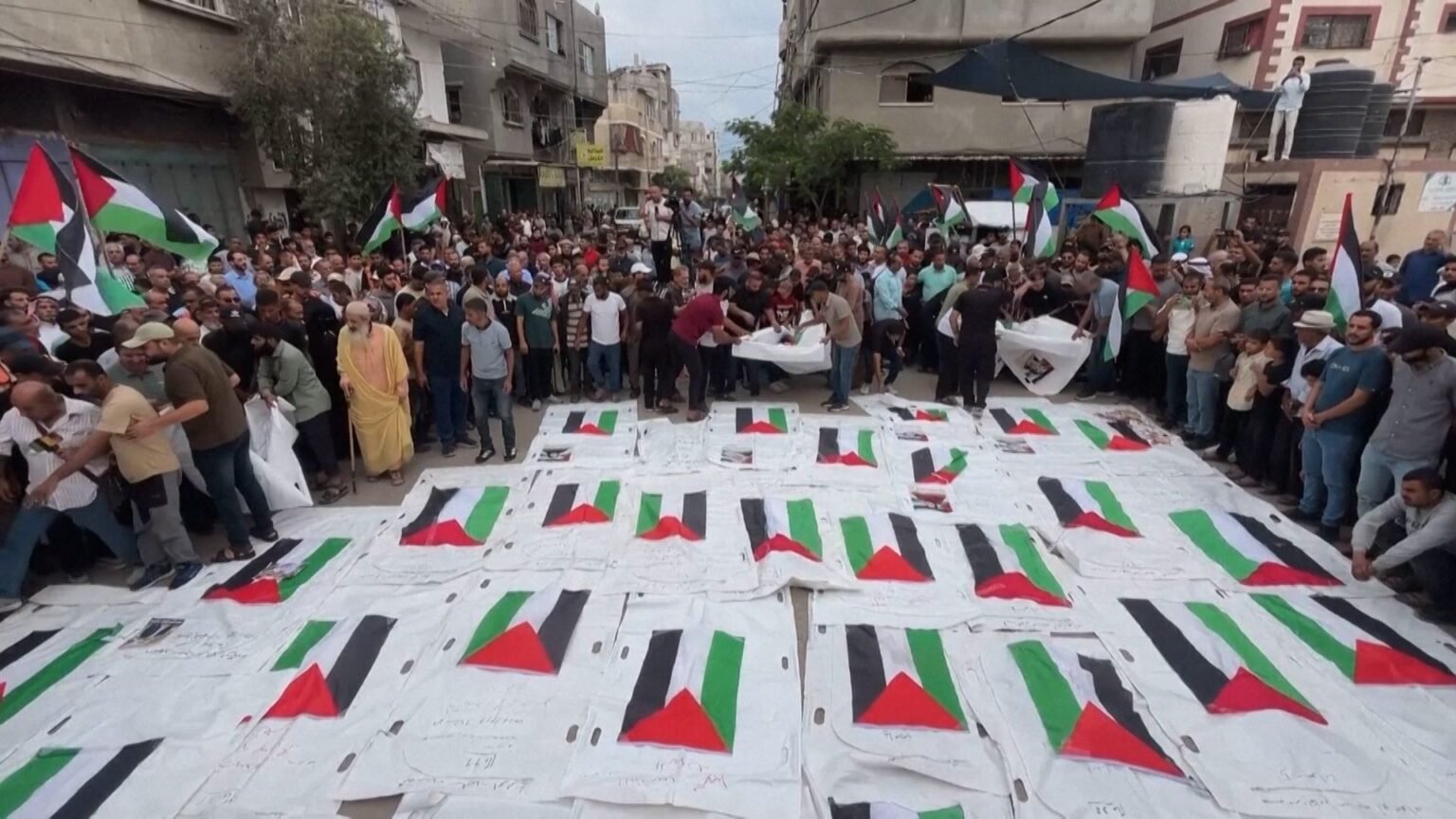 Mourners in Gaza bury remains of loved ones killed in 2023 Israeli strike