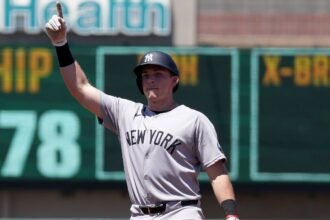 Rice bests Boone's belief by slugging homers 40, 41