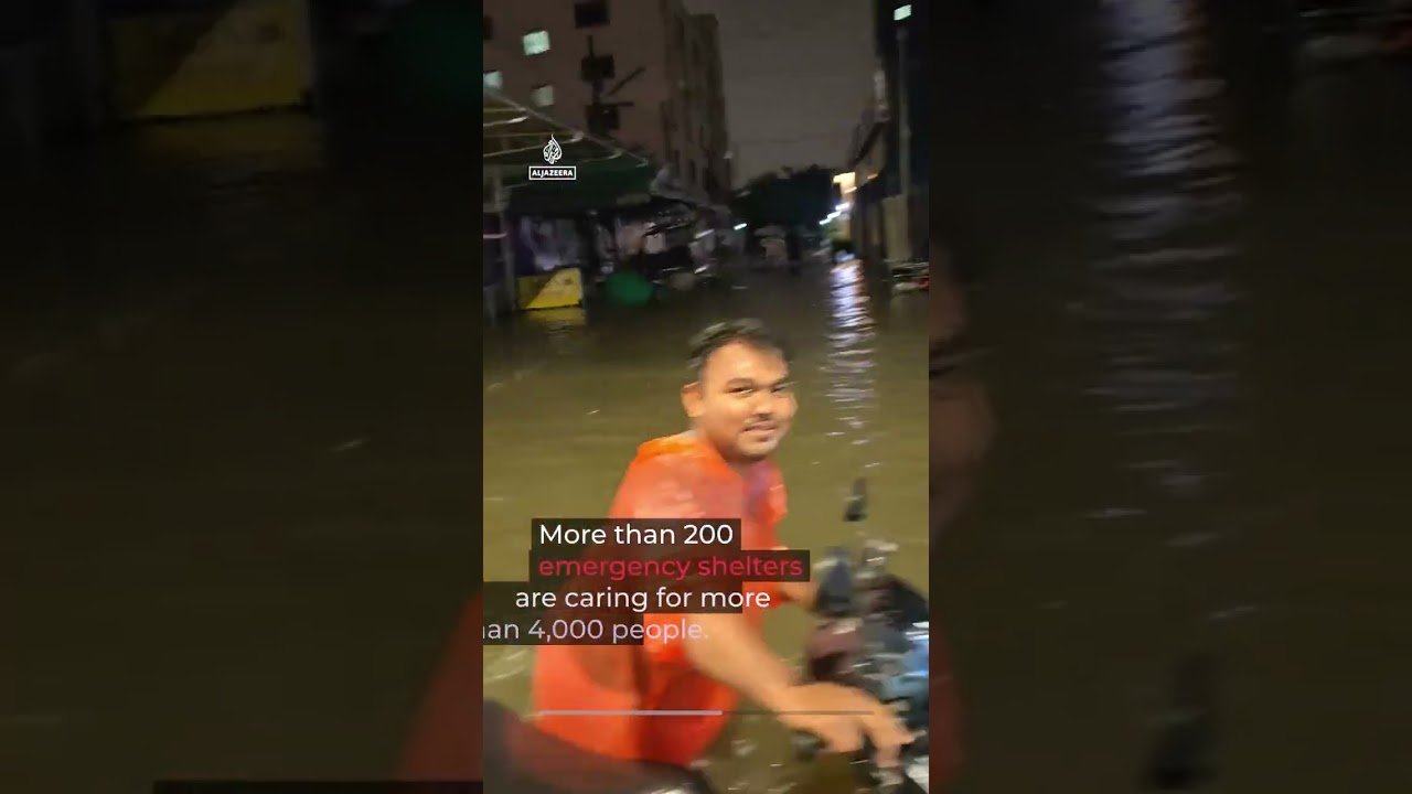 Bangkok declared disaster zone after heavy rains submerge road