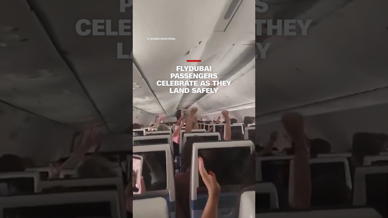 Flydubai passengers celebrate as they land safely
