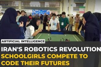 Iranian schoolgirls compete in robot football at Tehran's RoboCup