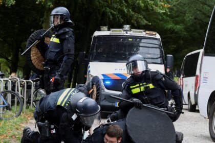 Dutch riot police break up violent far-right protest in The Hague