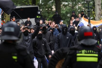 Police clash with hundreds of far-right protesters in The Hague