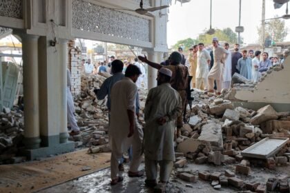 At least 16 killed in car bomb at mosque near police compound in Pakistan