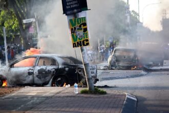 Cars burned and shops looted as anti-immigration protests rock South Africa