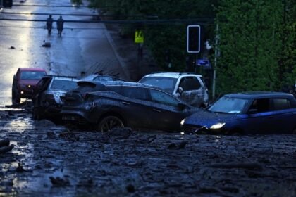 Six injured as heavy rains batter Chile's capital, sweeping away cars and flooding homes