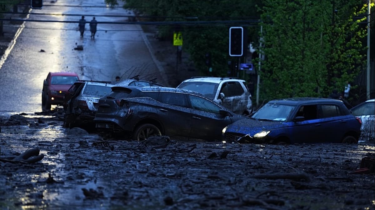 Six injured as heavy rains batter Chile's capital, sweeping away cars and flooding homes