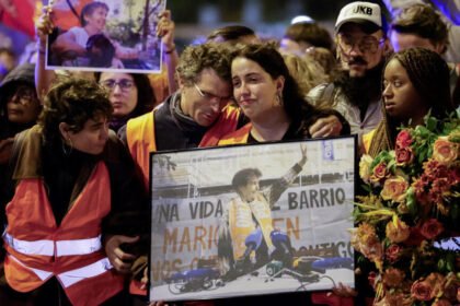 Tens of thousands march in Madrid to mourn pensioner whose eviction sparked housing protests
