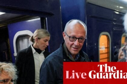 Friedrich Merz begins unannounced Kyiv visit as Russia continues strikes on Ukraine’s capital – Europe live