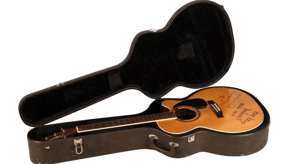 Oasis acoustic guitar sells for 'record' price