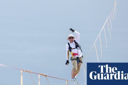 Daredevil Jaan Roose prepares to walk slackline high above central Seoul