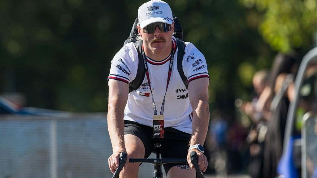 Bottas cycling from Malaysia to Singapore Grand Prix