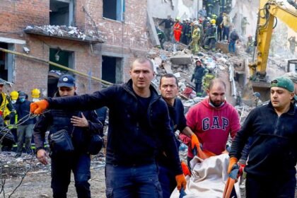 Children killed while they slept as Russian missile kills 19 in block of flats