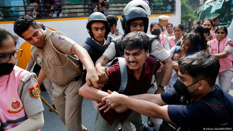 Indian police crack down on 'Cockroach' protest in Delhi