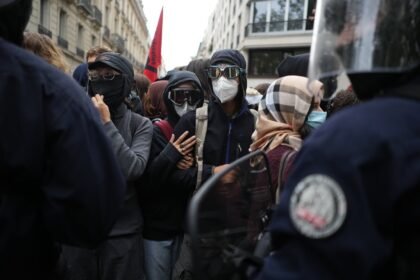 Police fire tear gas at a barricaded high school in Paris as school protests show no sign of ending