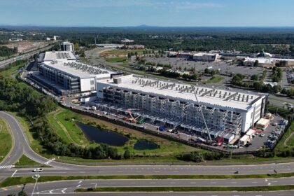 Amazon will ditch data center NDAs and invest $1 billion in host communities as backlash grows