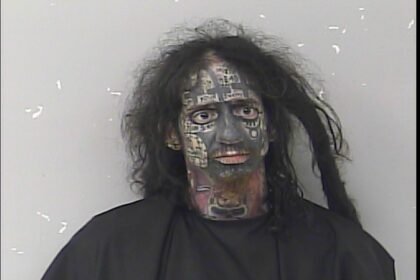Bizarre mugshot shows ‘demonologist’ accused of tracking women by their phones