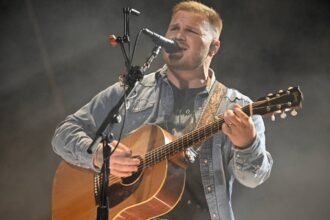 Zach Bryan Wears ‘Free Palestine’ Shirt at Gillette After Owner Robert Kraft Banned Macklemore