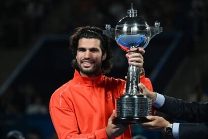 Djokovic wins China Open after de Minaur retires, Alcaraz wins Japan Open