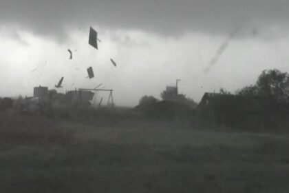 Debris flies across central Kansas as storms slam Plains