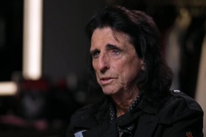 Alice Cooper warms up for his outrageous on-stage antics by throwing knives