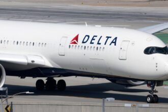 Delta CEO says demand is still strong despite company slashing 2026 profit forecast