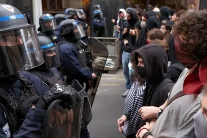 France halts stun grenade use after boy's hand blown off in student protests