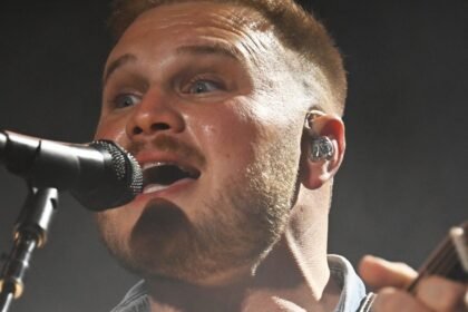 Zach Bryan wears "Free Palestine" shirt during concert at Gillette Stadium