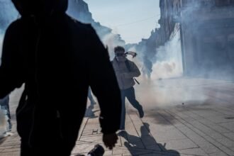 Teenager loses hand picking up grenade in France school protests