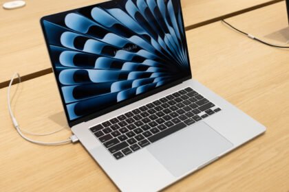 How does using your MacBook while charging affect its battery life?