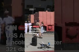 USS Abraham Lincoln docks after 321 days