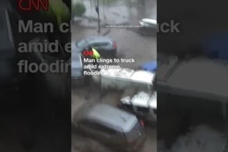 Man clings to truck amid extreme flooding in Chile