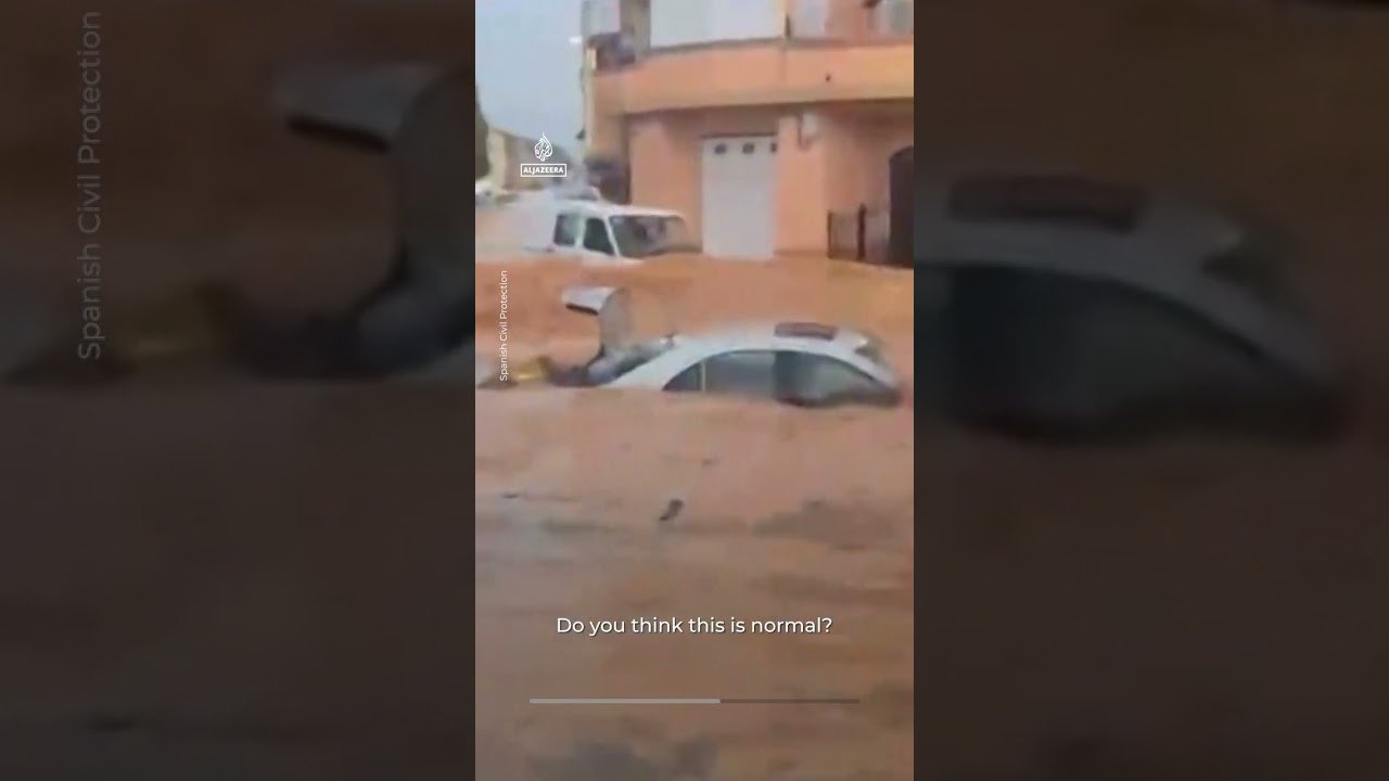 Floods sweep cars through streets after intense rain in Spain