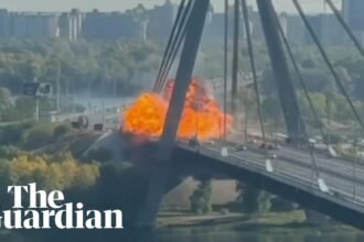 Russian drone hits key bridge in Kyiv on German chancellor's visit