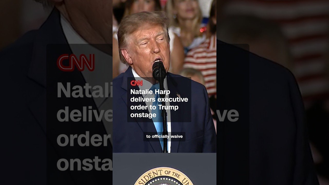 Natalie Harp delivers executive order to Trump onstage