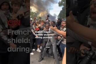 French mayor shields students during protests