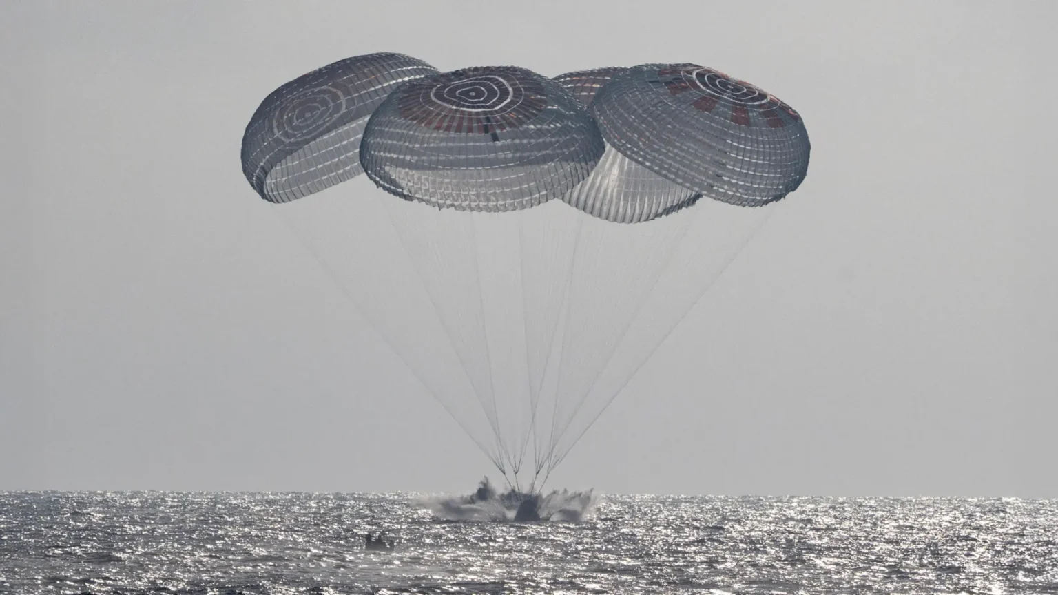 NASA astronauts splash down after 100 million miles in space