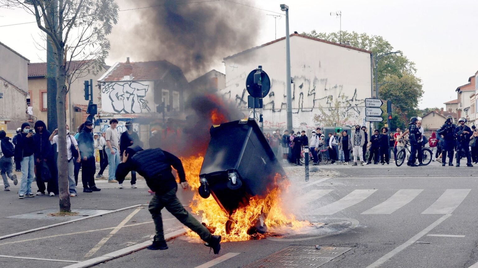 Tear gas and fires on French streets as student protests turn violent